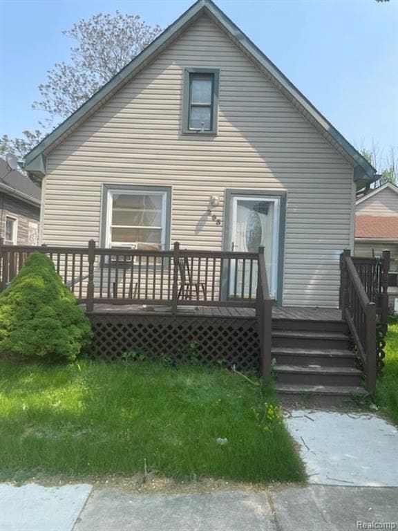 back of property with a wooden deck