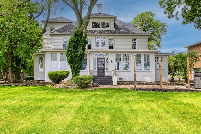 view of front of home with a front lawn