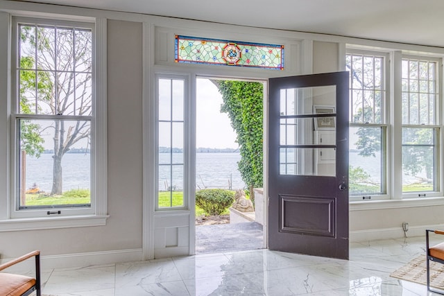 entryway with a water view and plenty of natural light