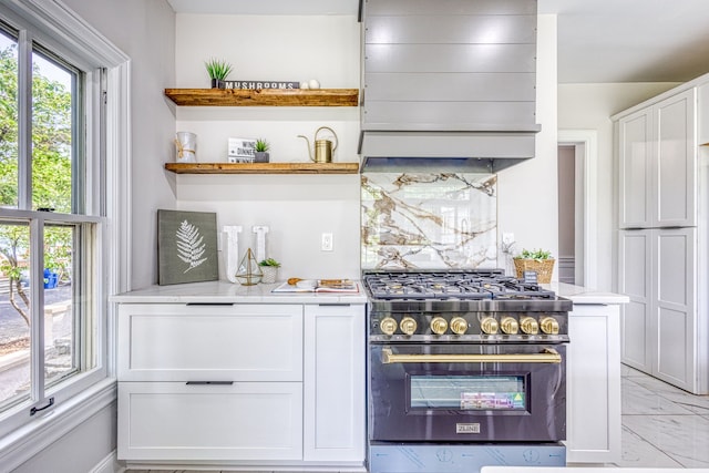 bar with stainless steel range and white cabinetry