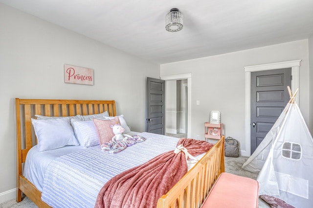 bedroom featuring light colored carpet