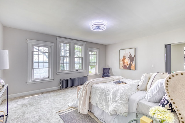 carpeted bedroom with radiator