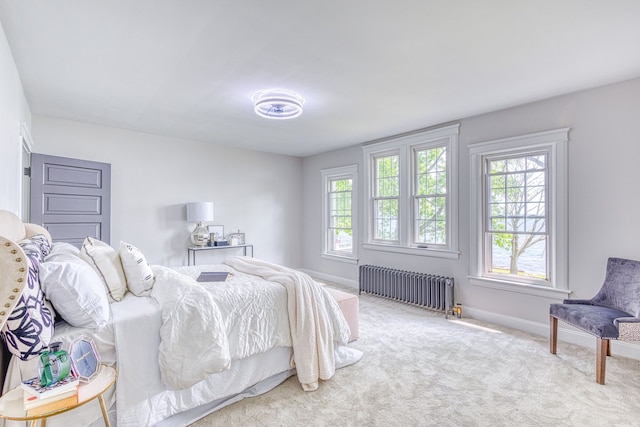 carpeted bedroom featuring radiator heating unit