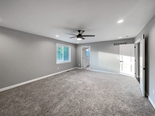 carpeted empty room with ceiling fan