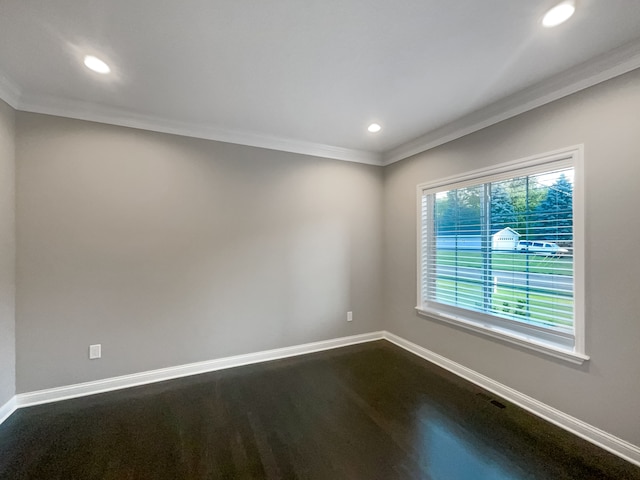 unfurnished room with wood-type flooring and ornamental molding