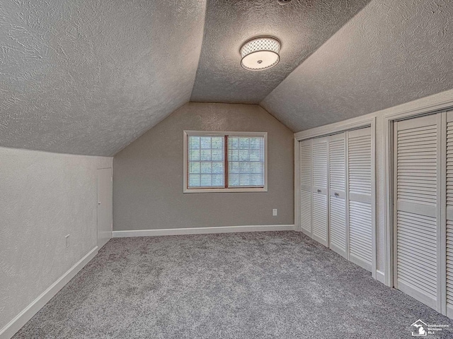 bonus room featuring carpet and lofted ceiling