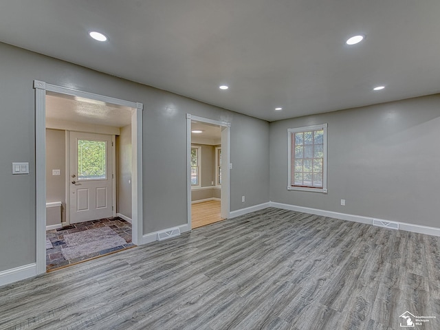 spare room with light hardwood / wood-style flooring