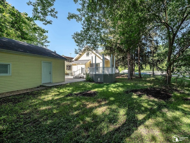 view of yard featuring a wooden deck