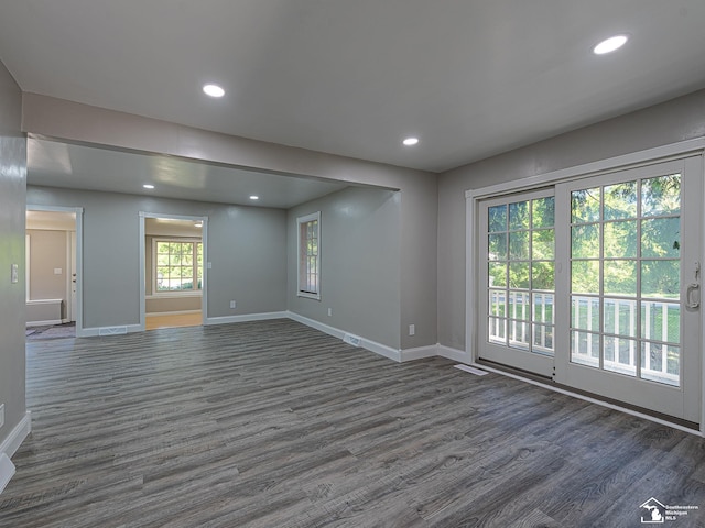 empty room with dark wood-type flooring