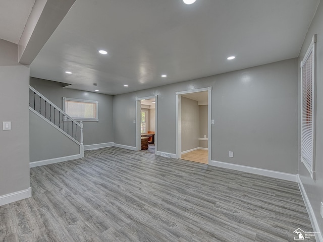 unfurnished living room featuring light hardwood / wood-style flooring