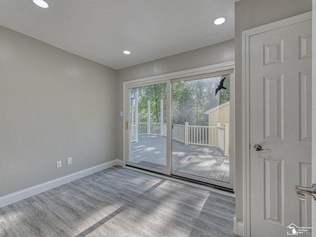 spare room featuring light hardwood / wood-style flooring