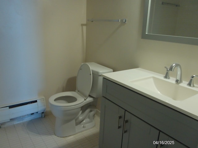 bathroom with tile patterned flooring, toilet, a baseboard heating unit, and vanity