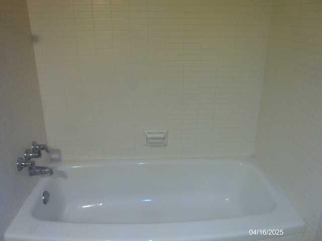 bathroom featuring a tub