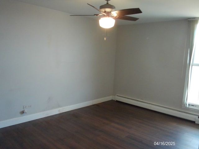 empty room with a healthy amount of sunlight, a baseboard radiator, a ceiling fan, and wood finished floors