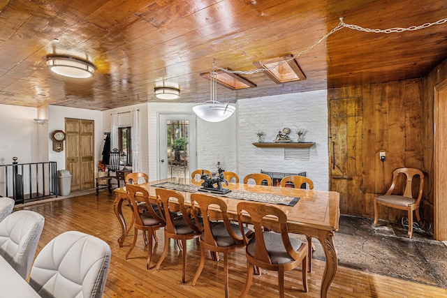 6888 Ann Arbor Rd, Jackson, MI 49201 - dining room featuring wooden ceiling, hardwood / wood-style flooring, and wooden walls