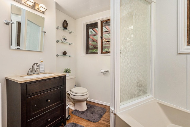 6888 Ann Arbor Rd, Jackson, MI 49201 - bathroom with toilet, vanity, wood finished floors, and  shower combination
