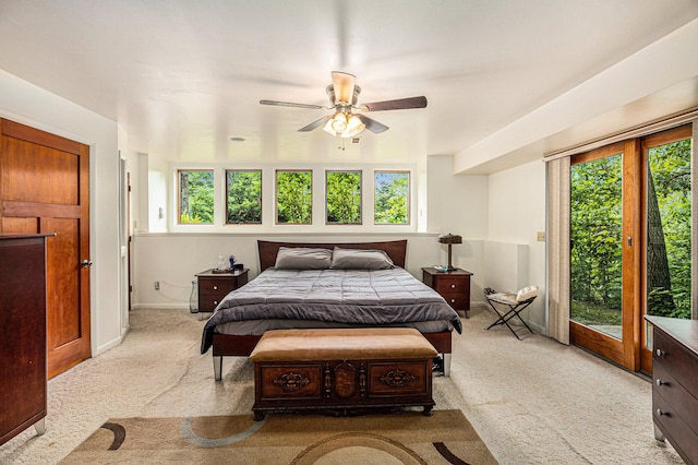 6888 Ann Arbor Rd, Jackson, MI 49201 - carpeted bedroom with multiple windows, access to outside, and a ceiling fan