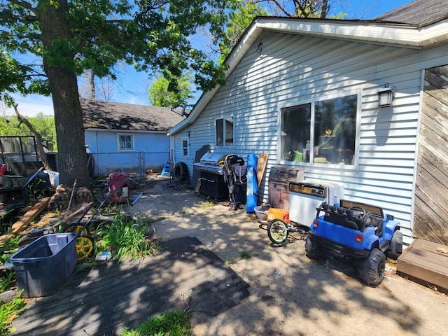 view of property exterior with a patio area