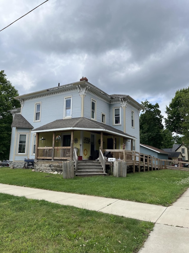423 Oak St, Paw Paw, MI 49079 - italianate house featuring covered porch and a front lawn