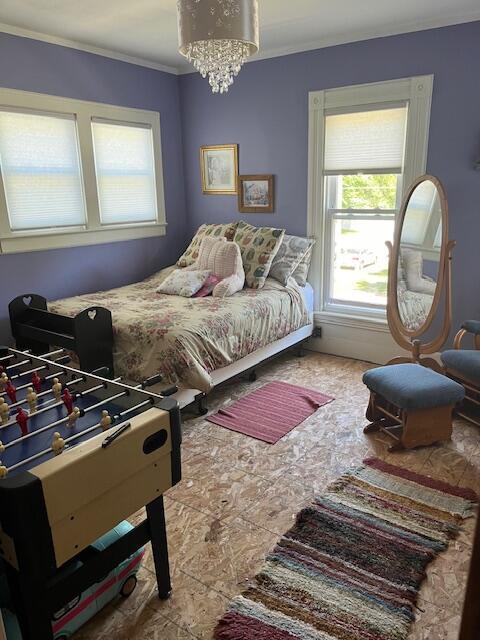 423 Oak St, Paw Paw, MI 49079 - bedroom with a chandelier and crown molding