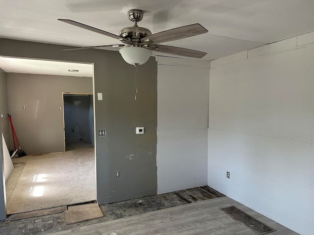 spare room with ceiling fan and hardwood / wood-style floors