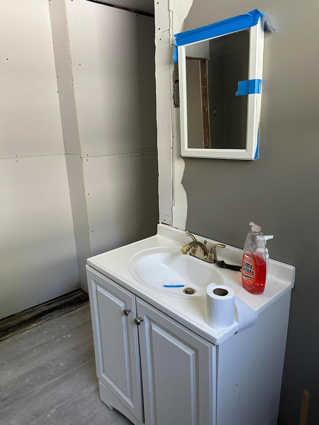 bathroom with vanity and wood-type flooring