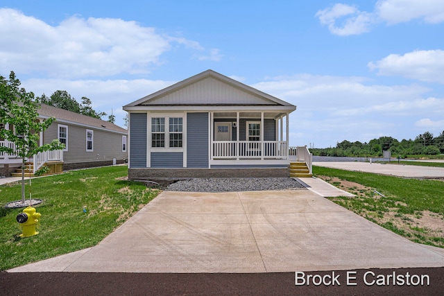 view of front of home with a porch and a front yard