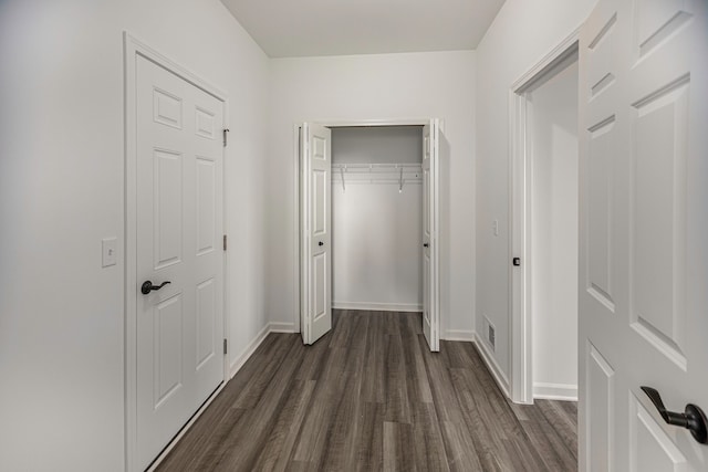 hallway featuring dark wood-type flooring