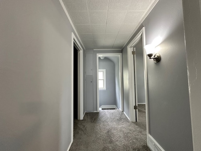 hall with dark carpet