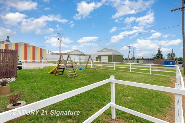 view of playground featuring a yard