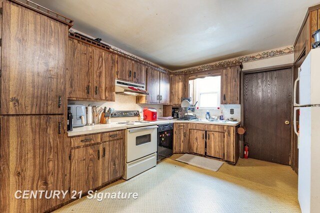 kitchen with tasteful backsplash and white appliances