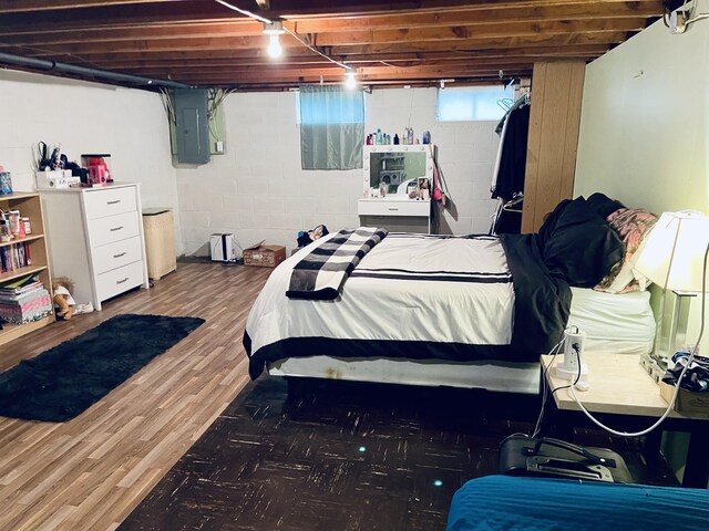 bedroom featuring hardwood / wood-style flooring and electric panel