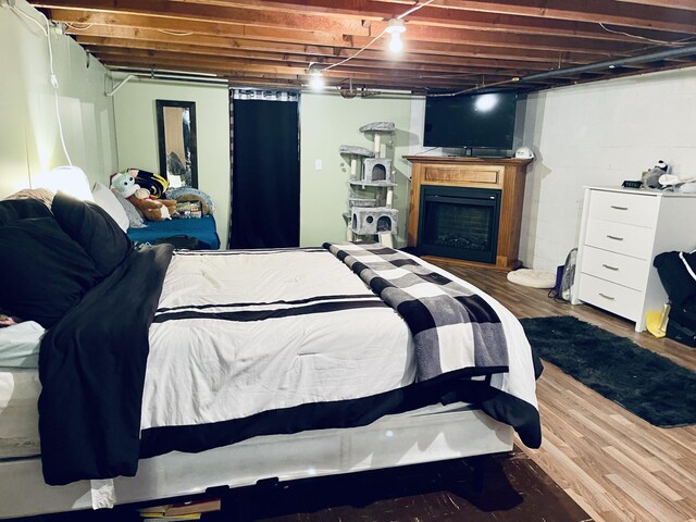 bedroom featuring wood-type flooring