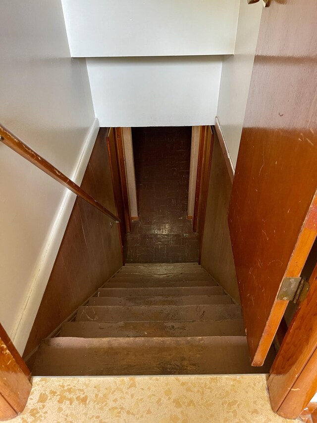 stairway featuring hardwood / wood-style flooring