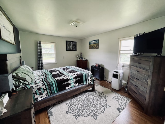 bedroom featuring wood-type flooring