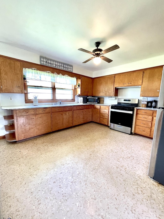 kitchen featuring ceiling fan and appliances with stainless steel finishes