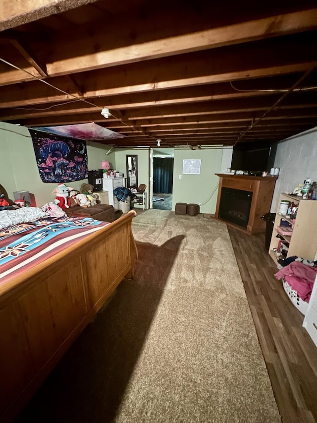 bedroom with dark hardwood / wood-style floors