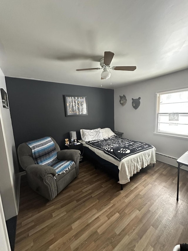 bedroom featuring hardwood / wood-style floors and ceiling fan