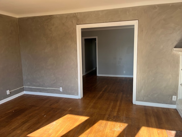 empty room featuring dark wood-type flooring