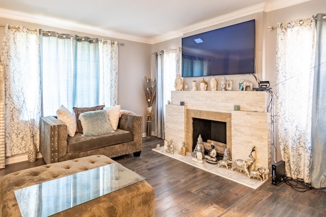 living room featuring ornamental molding, a healthy amount of sunlight, and dark hardwood / wood-style flooring