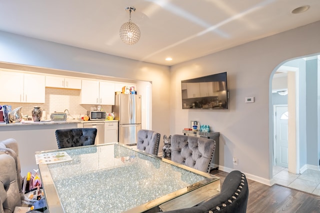 dining area with dark hardwood / wood-style flooring