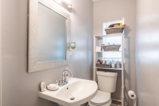 bathroom featuring sink and toilet