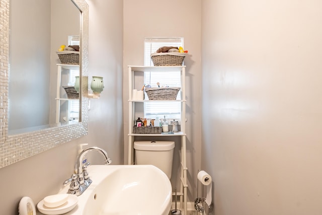 bathroom with sink and toilet