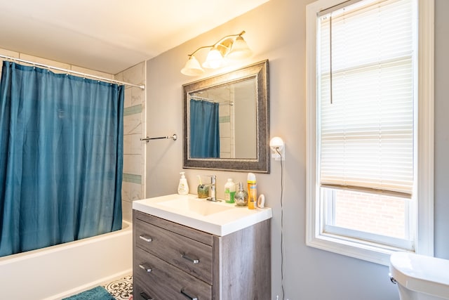 full bathroom featuring vanity, toilet, and shower / tub combo with curtain