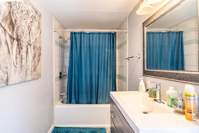 bathroom with vanity and shower / bath combo with shower curtain