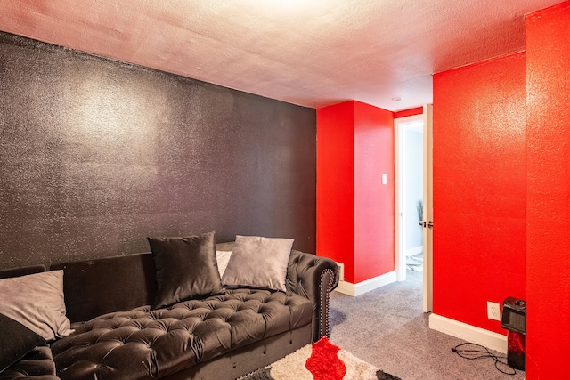 carpeted living room featuring a textured ceiling