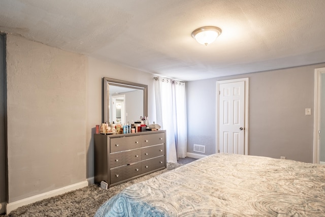 bedroom featuring dark colored carpet