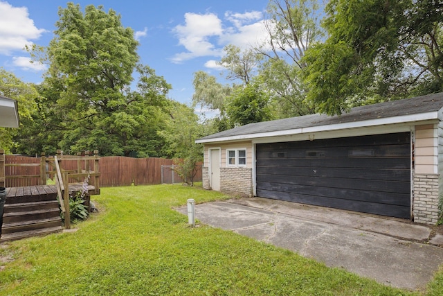 garage featuring a yard