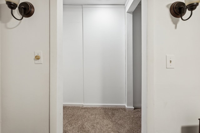 hallway featuring light carpet