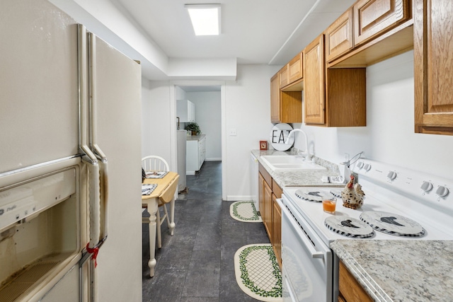 kitchen with white appliances and sink